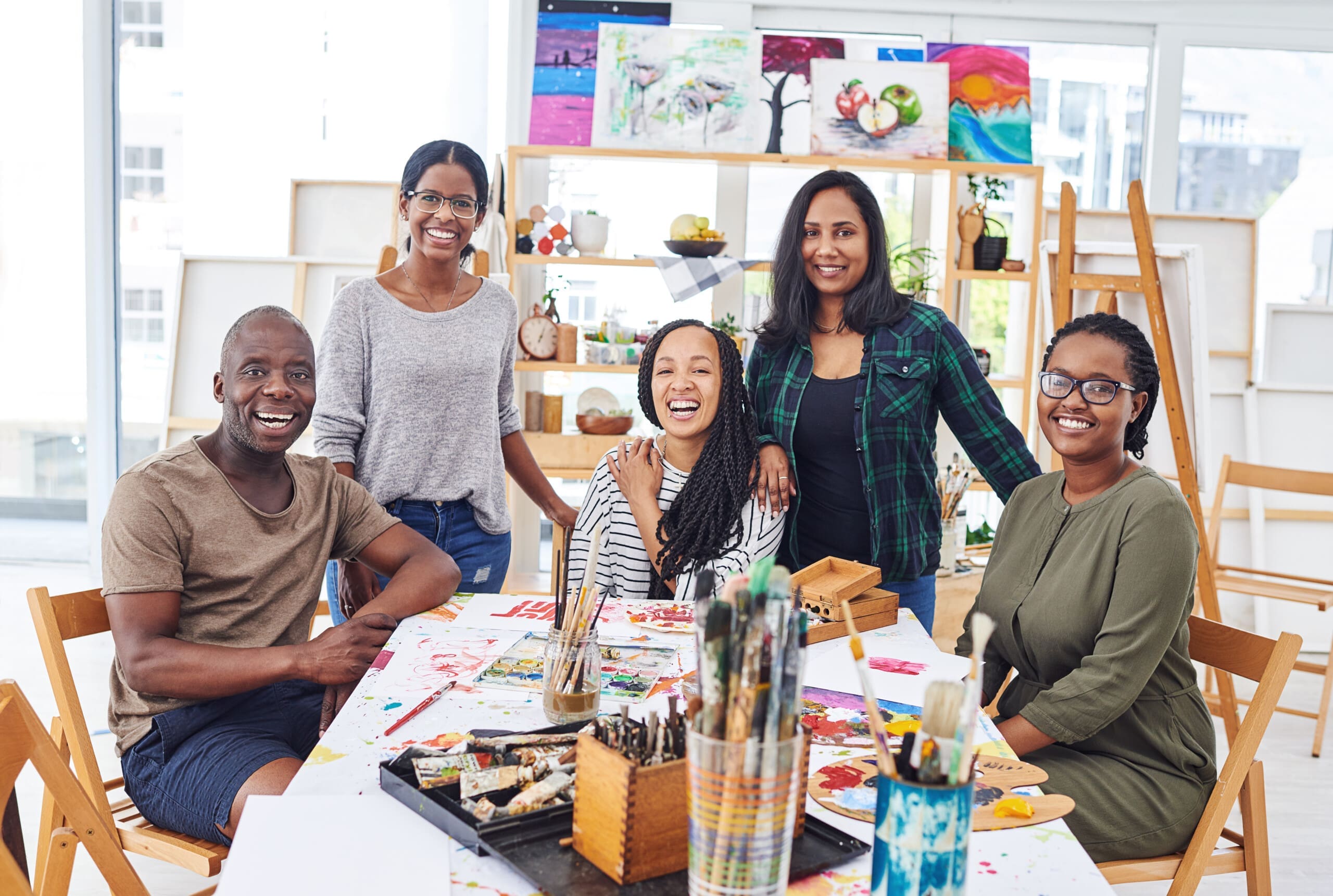 A group of people satisfied after an art therapy session and lessons on how art therapy can help with anxiety.
