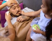 A sick father is cared for by his two children. They make sure he is mentally and physically healthy. This helps him take part in family activities.
