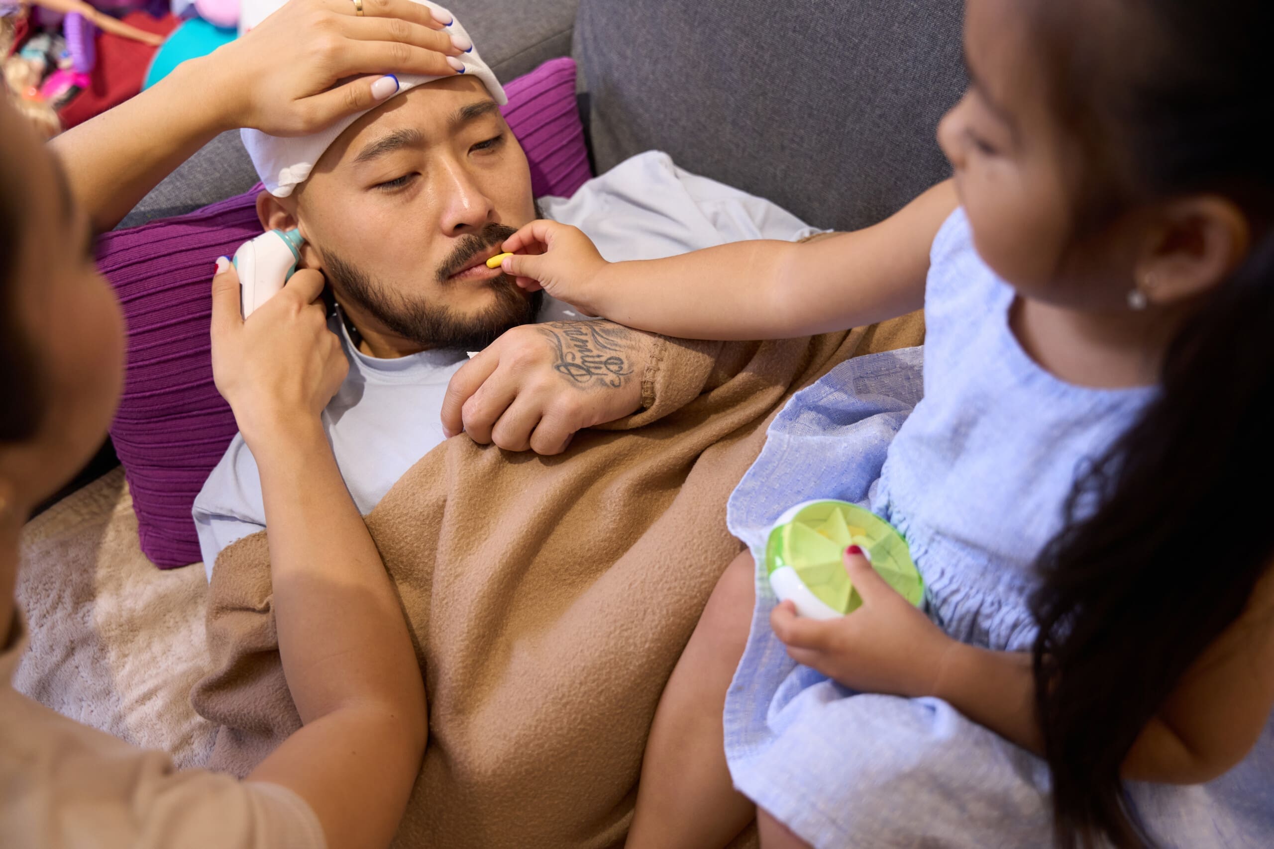 A sick father is cared for by his two children. They make sure he is mentally and physically healthy. This helps him take part in family activities.